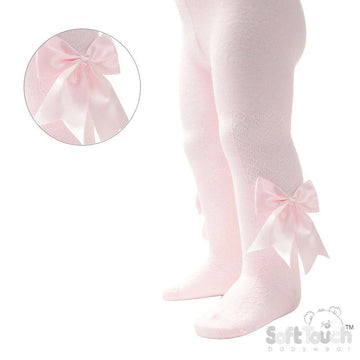 Pink tights with large bows and heart design on a white background, featuring the Soft Touch brand.