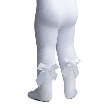 White jacquard tights with bow details on a white background