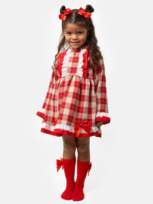 Spanish red, beige and white plaid dress with lace details and red bows on a mannequin.