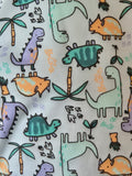Pattern of colorful dinosaurs and plants on a light background