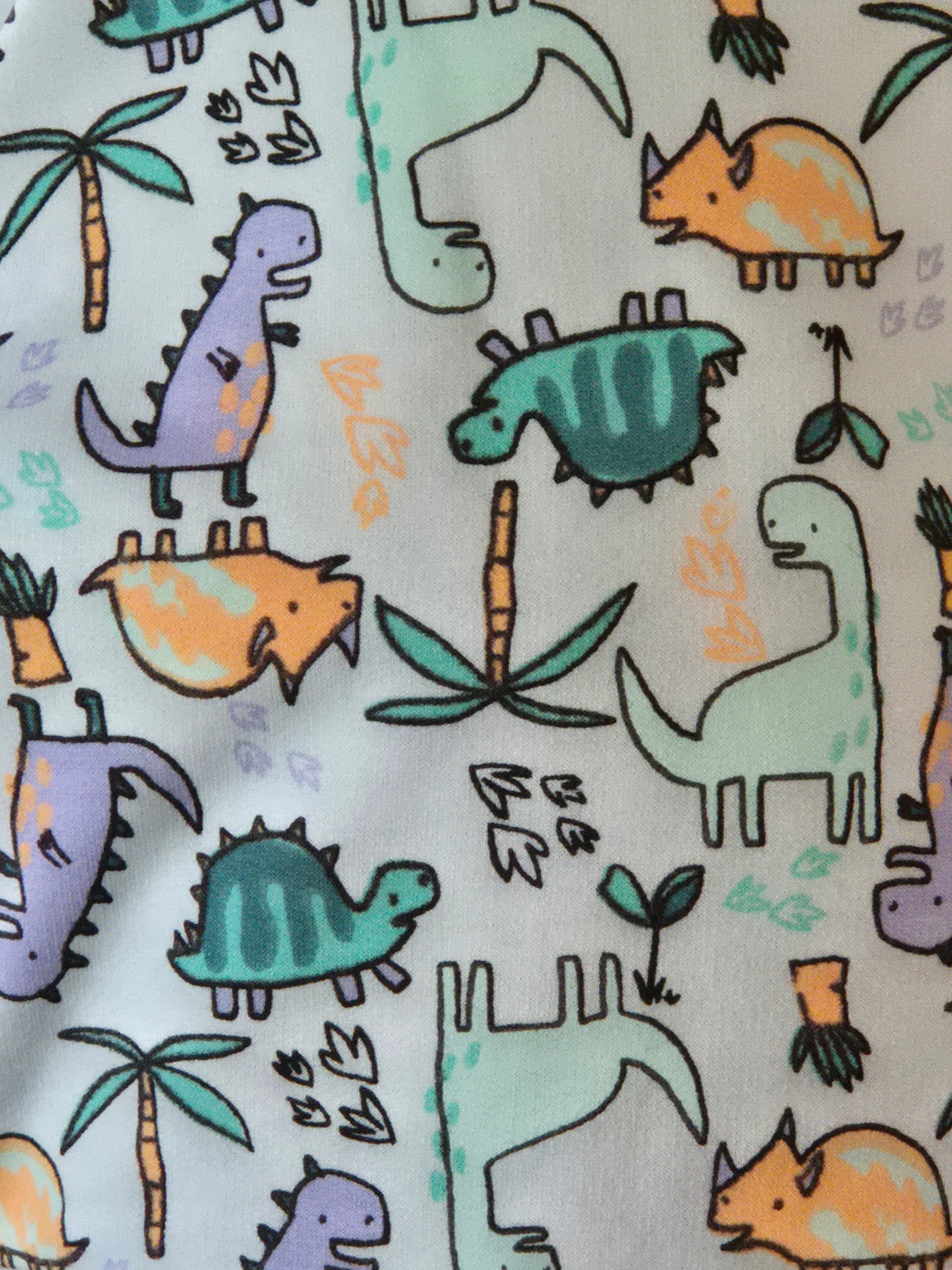 Pattern of colorful dinosaurs and plants on a light background