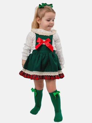 Children's dress with plaid skirt and red bow on a mannequin against a white background
