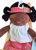 Black rag doll with braids and stripy outfit