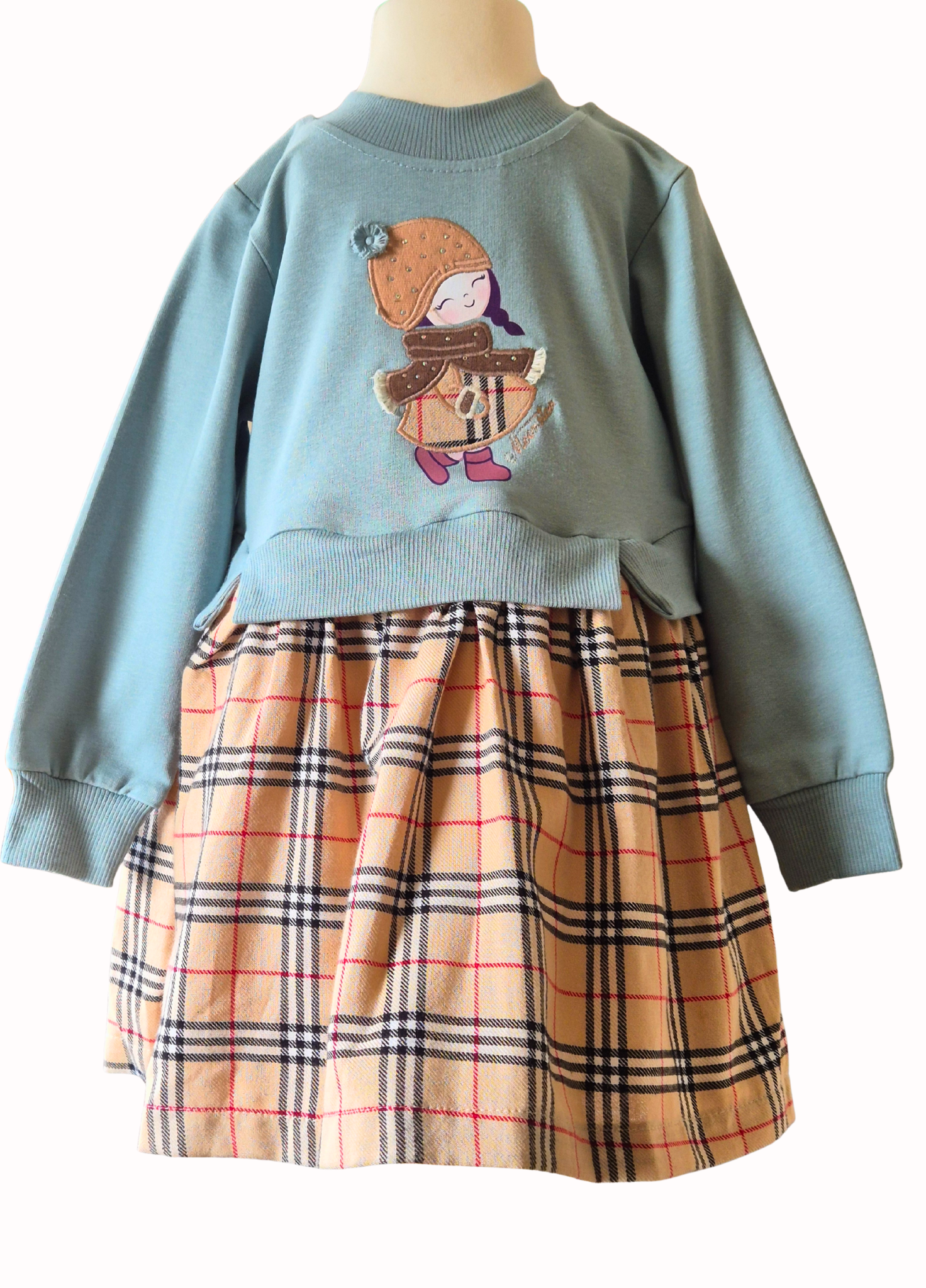 Children's outfit with blue sweater and plaid skirt on a mannequin against a white background