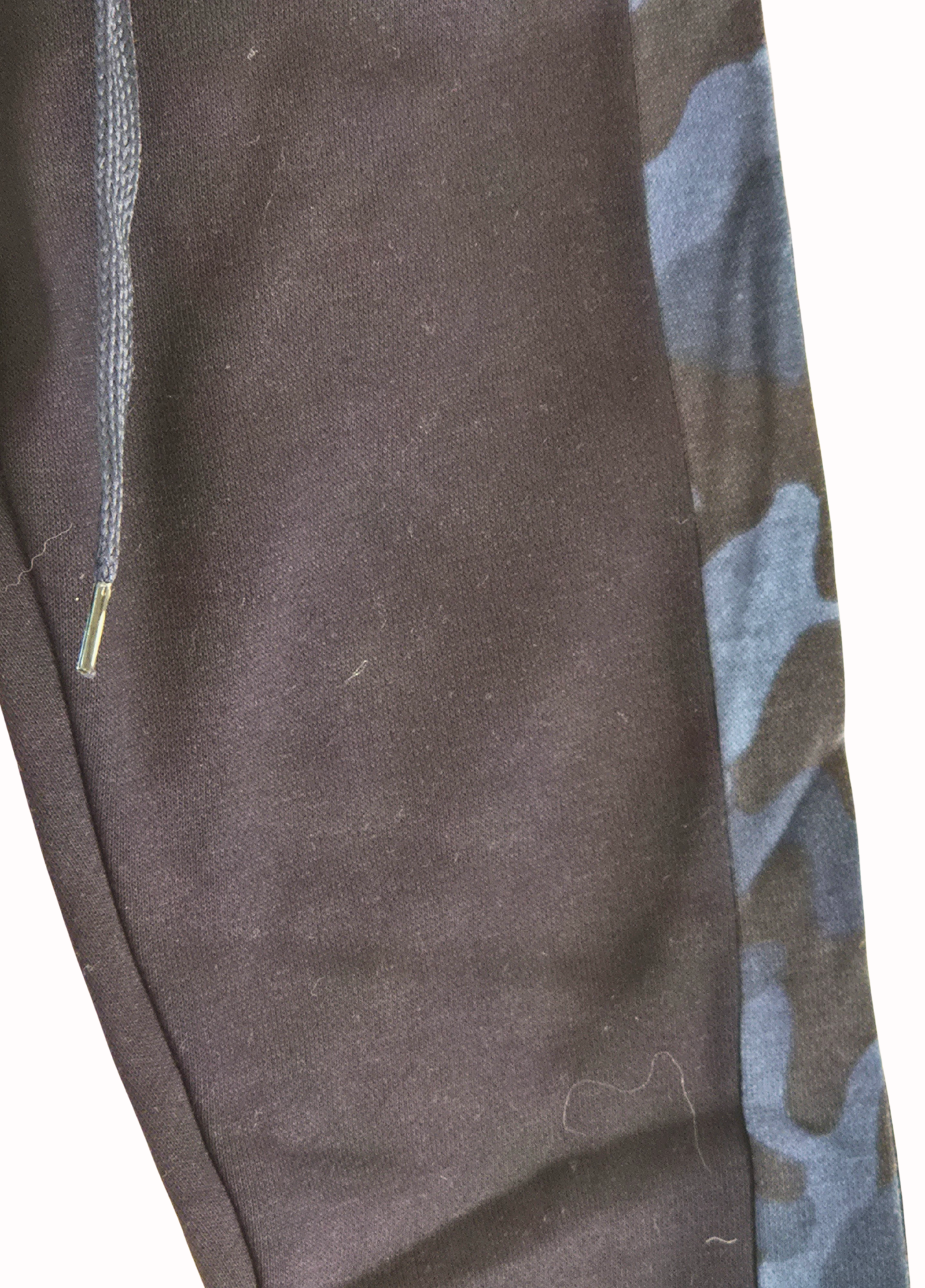 Navy sweatpants with a camouflage pattern on the side pocket against a white background