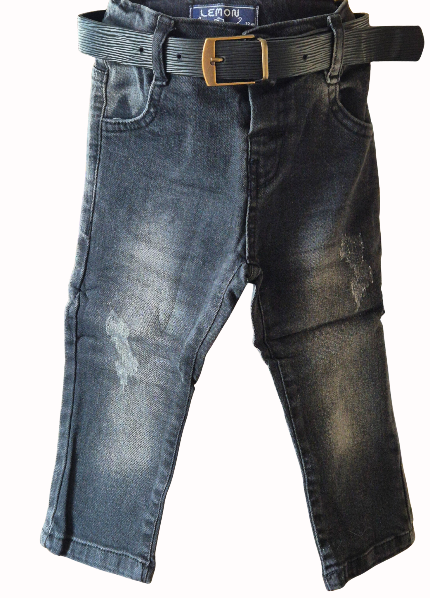 Distressed black jeans with a belt on a white background