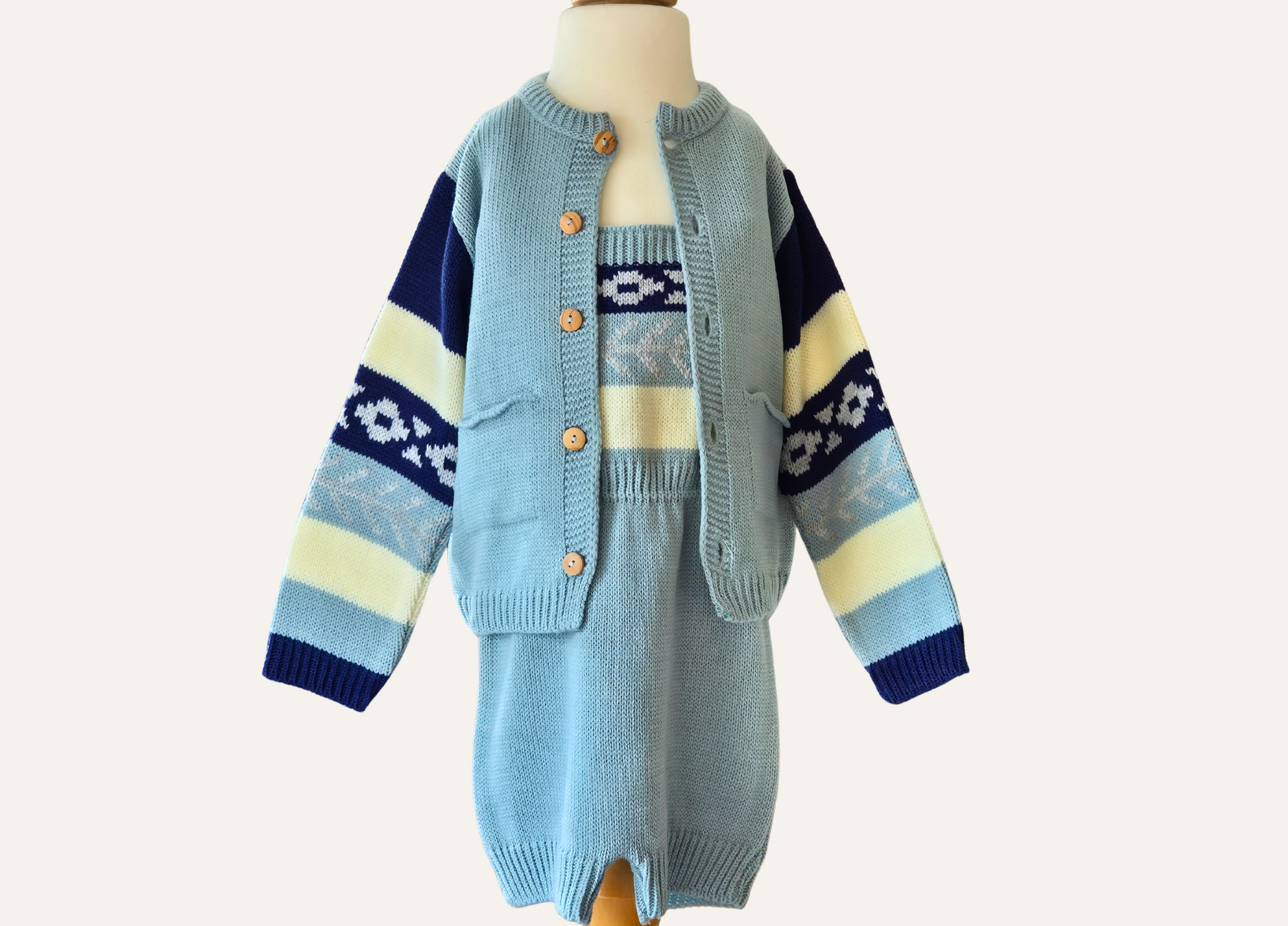 Close up of boys spanish knitted cardigan and short romper set