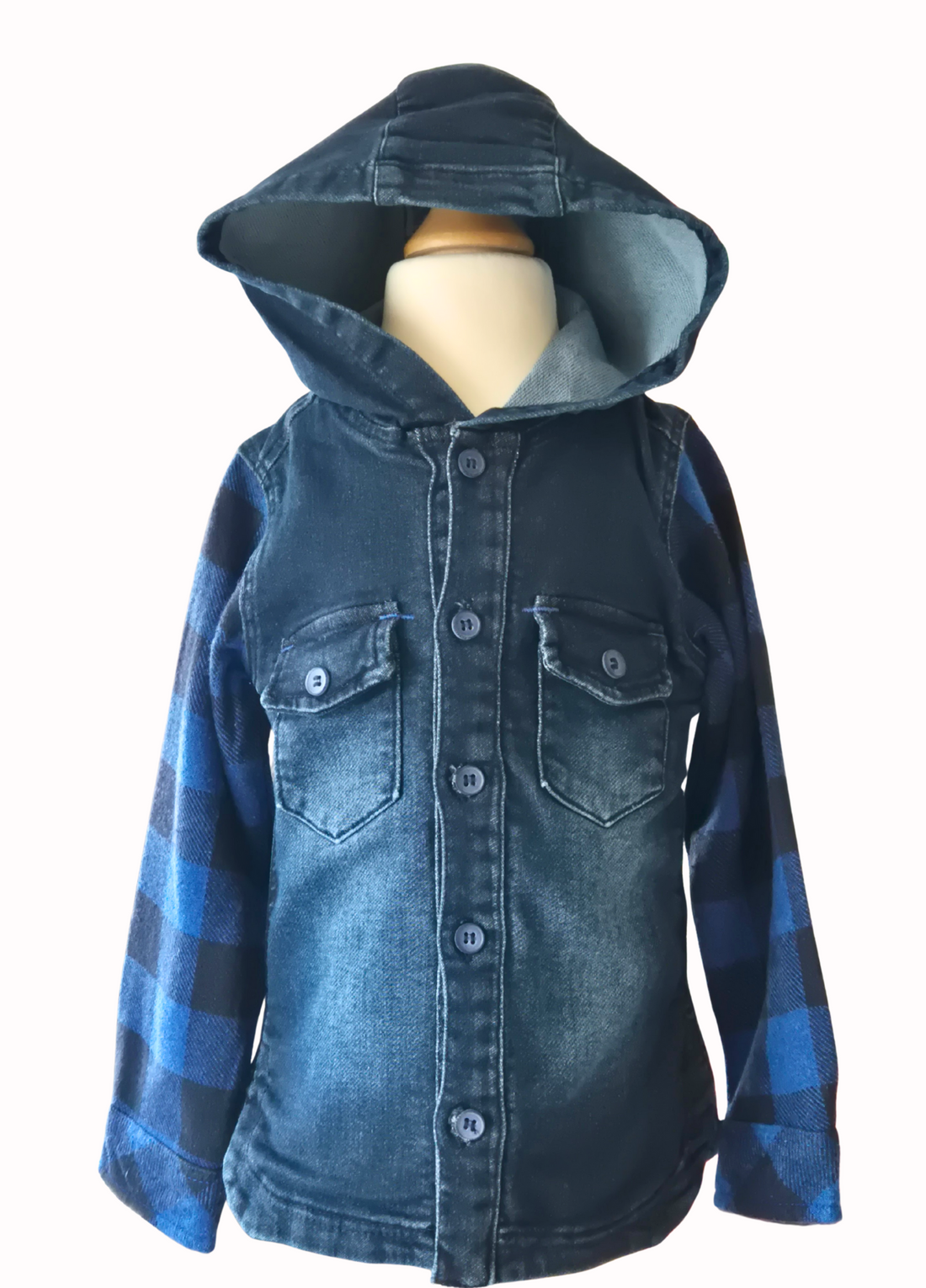 Blue denim hooded shirt with plaid sleeves on a mannequin against a white background