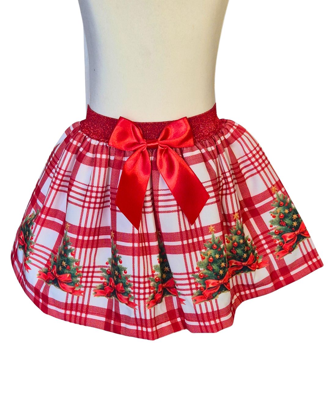 Girls’ red and white checked Christmas skirt with tree decorations