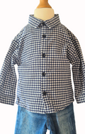 Blue and white checkered shirt on a mannequin with jeans