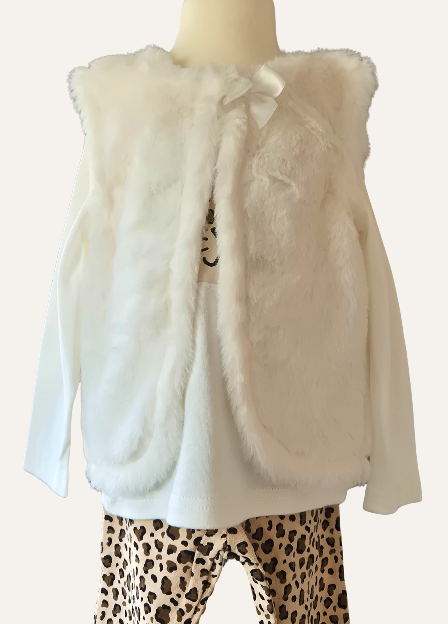 Close up of the faux fur gillet that is part of the girl 3 piece set