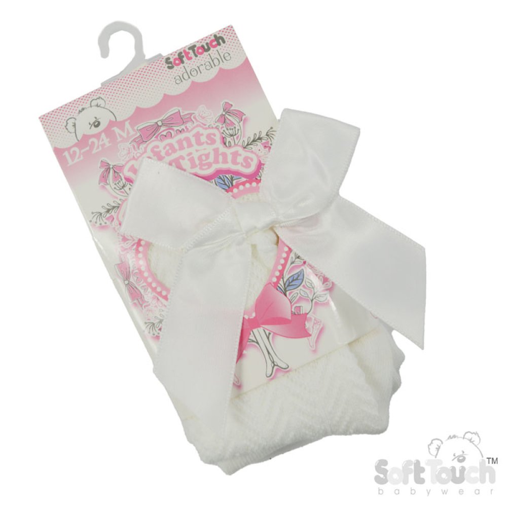Cream jacquard tights with bow details on a white background