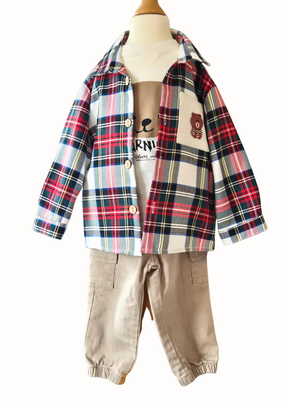 Plaid shirt and beige pants on a mannequin with a white background