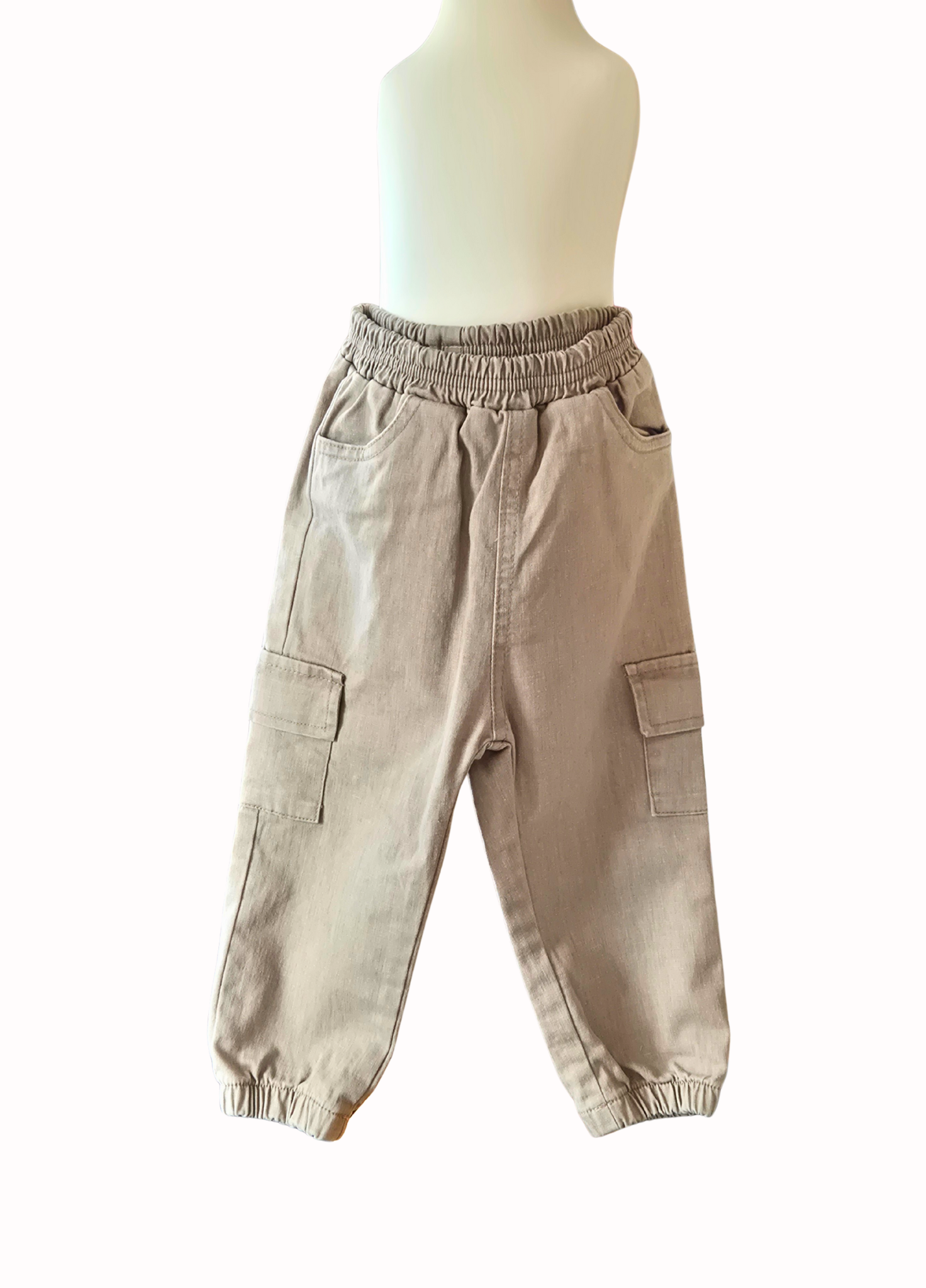 Beige cargo pants on a mannequin against a white background