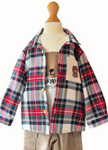 Plaid shirt over a white long sleeved top with visible branding on a mannequin against a white background