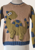 Knitted sweater with dinosaur design on a mannequin