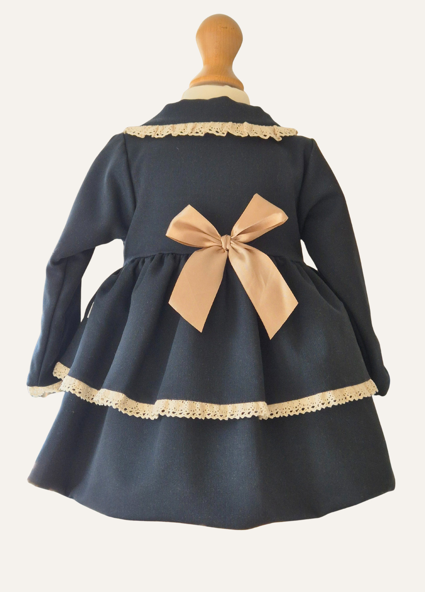 Girls Navy Blue and cream lace trim spanish coat with bows back view