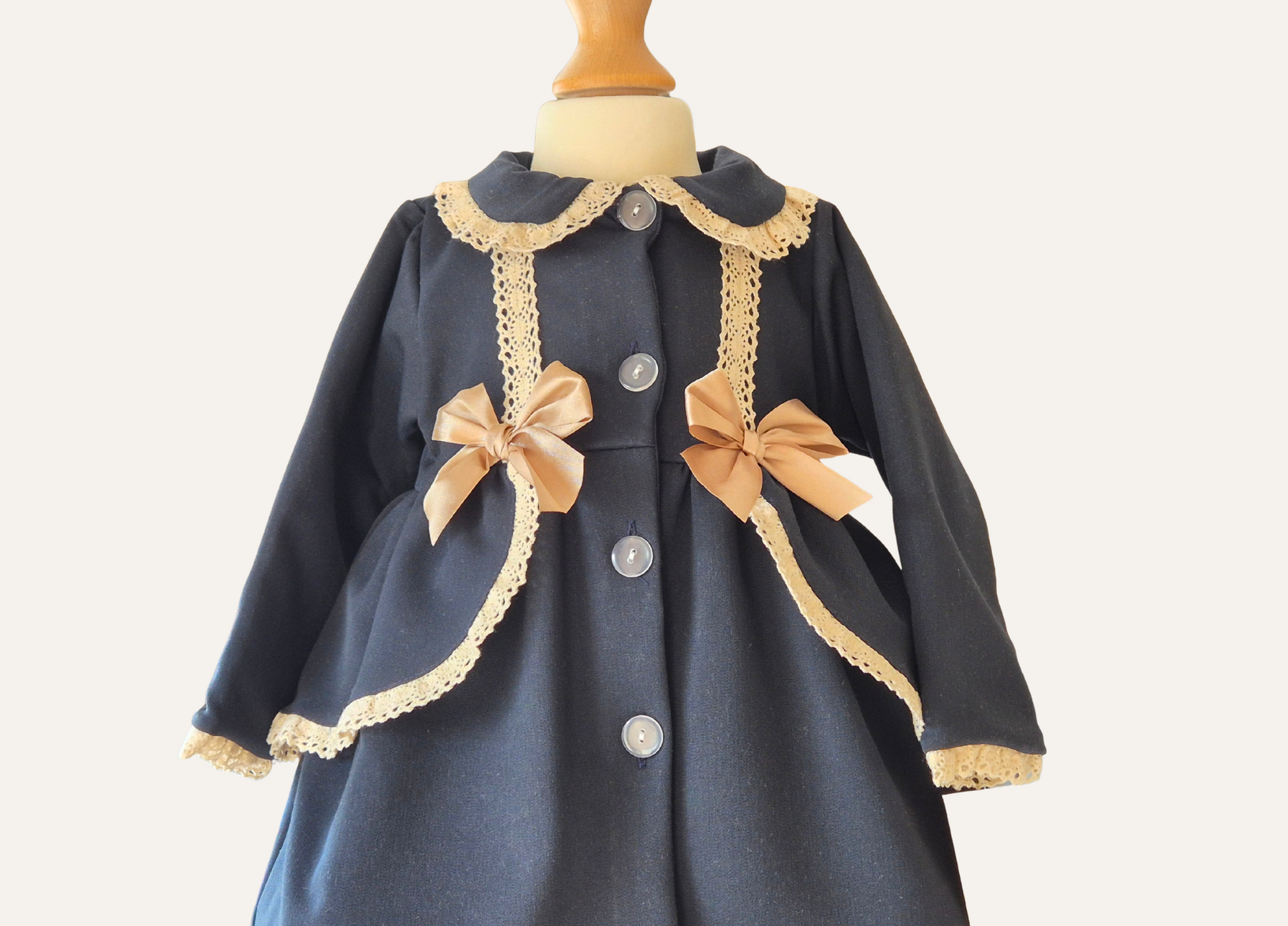 Girls Navy Blue and beige lace trim spanish coat with bows front close up