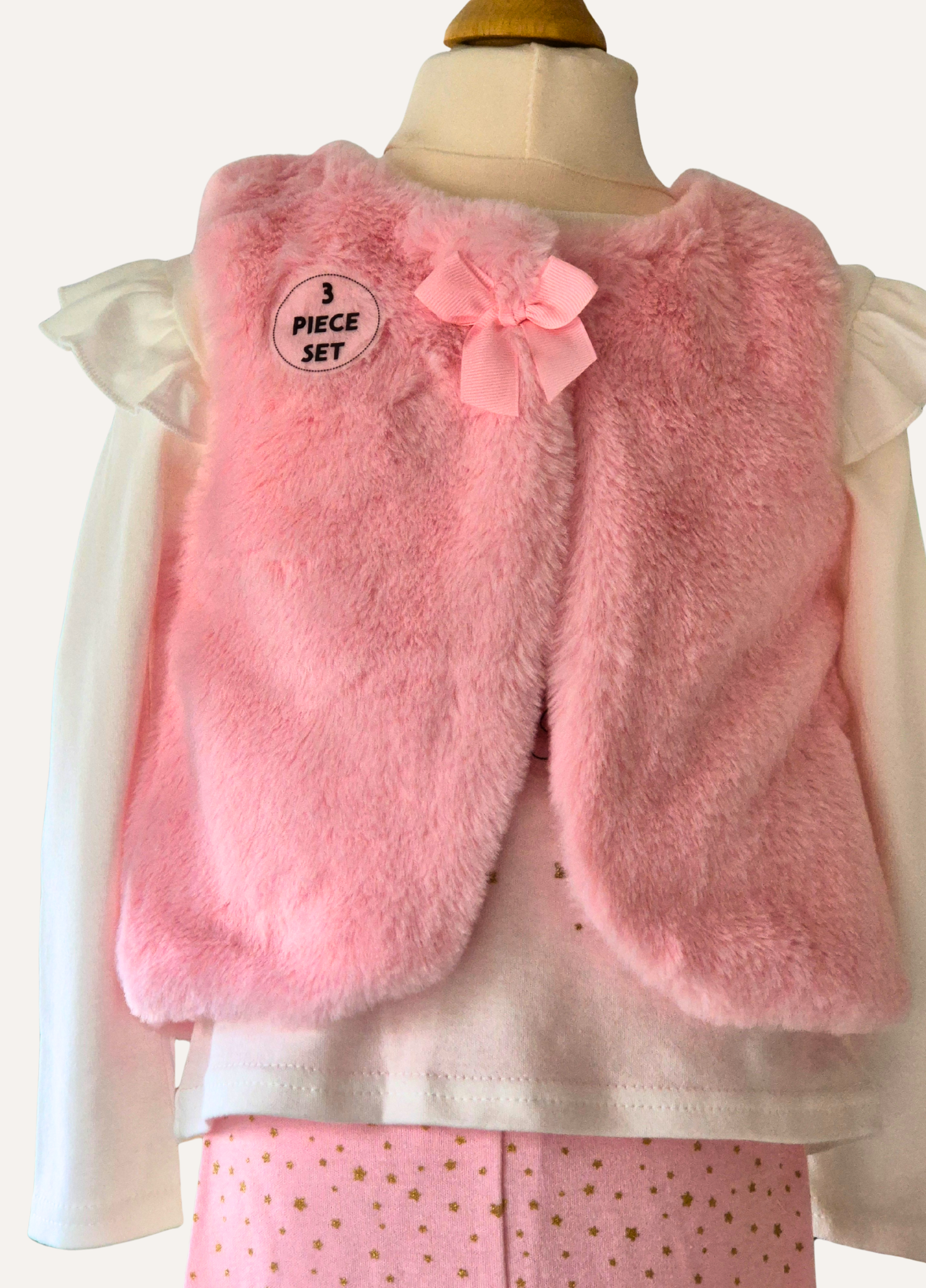 Close up of pink faux fur gillet which is part of the 3 piece set from Lily & Jack