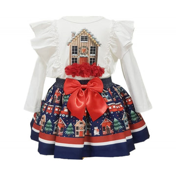 White top featuring a gingerbread house and a blue, red and white skirt with houses trees, snowmen and a christmas train around it.