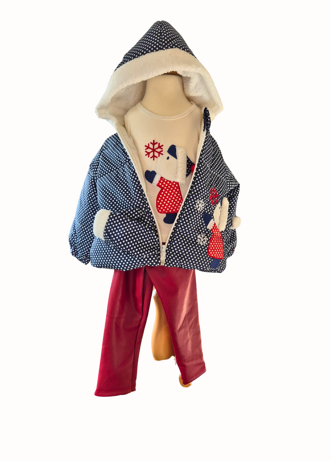 Children's outfit with a patterned jacket and red pants on a mannequin against a white background