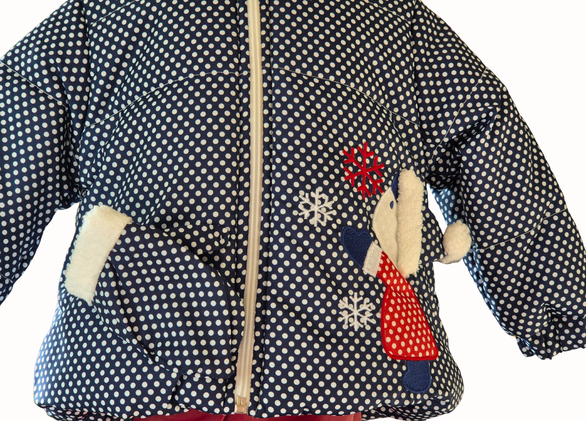 Children's polka dot jacket with winter-themed patches on a white background