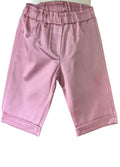 Girls dusky pink knee length shorts part of a two piece summer outfit.