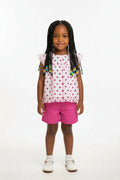 Girls summer outfit with cerise pink shorts and polka dot top