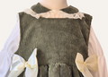 Close up detail of Girls Spanish Olive corduroy pinafore dress with matching lace collar blouse