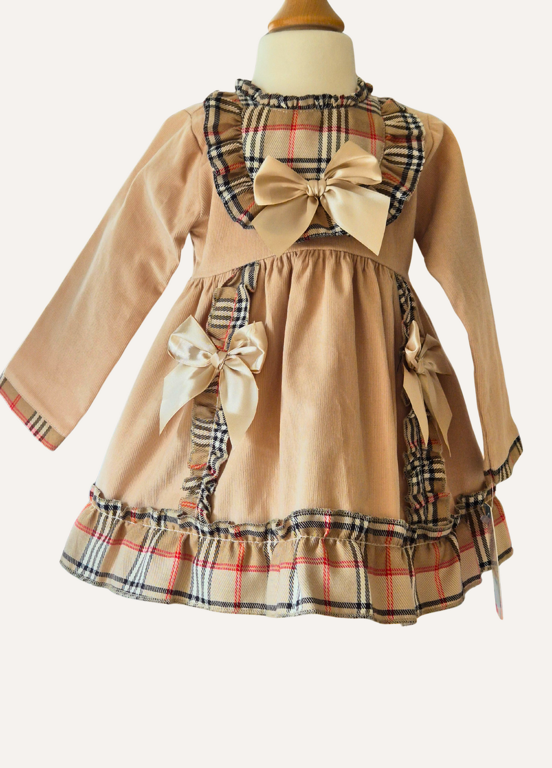 Girls Spanish Beige dress with plaid accents and large bows and frills 