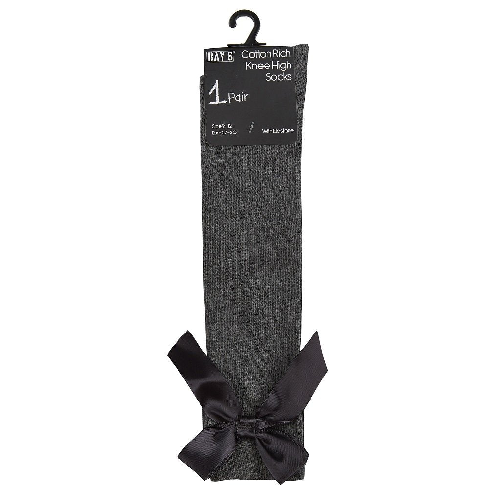 Gray knee-high sock with a black bow on a white background