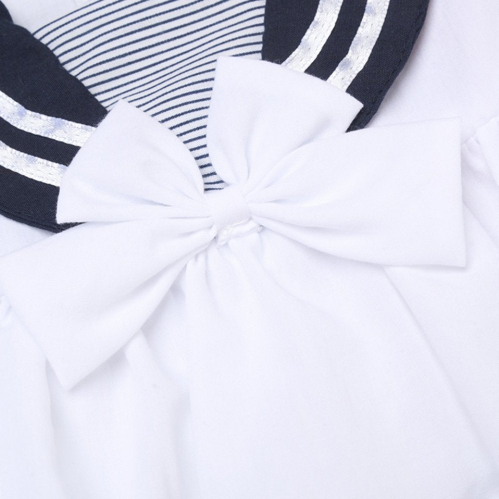 Close-up of ababy girls navy sailor summer dress