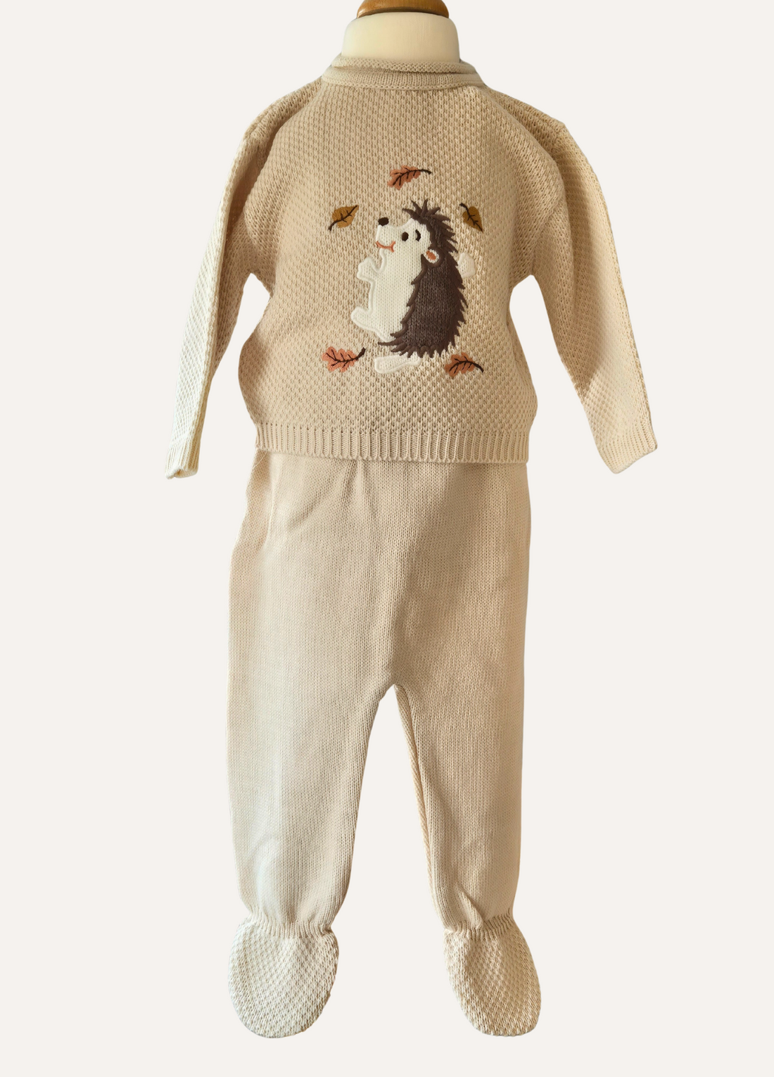 Beige knitted baby two piece set with hedgehog design from Dandelion