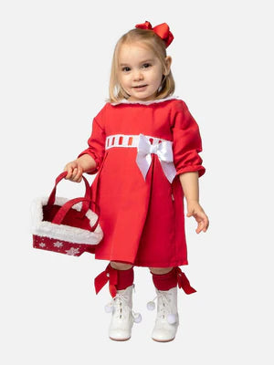 Child wearing Spanish red dress with lace collar and a white bow