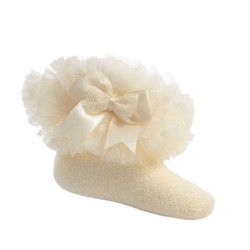 Lemon-colored baby mesh tutu sock with lemon and white dots bow on a white background