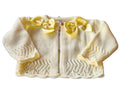 Lemon Knitted baby cardigan with double satin yellow bows on a white background