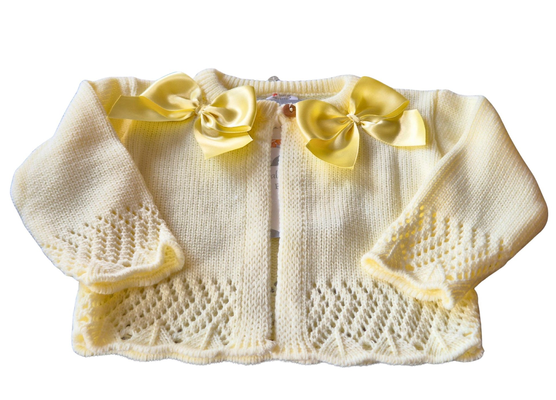 Lemon Knitted baby cardigan with double satin yellow bows on a white background
