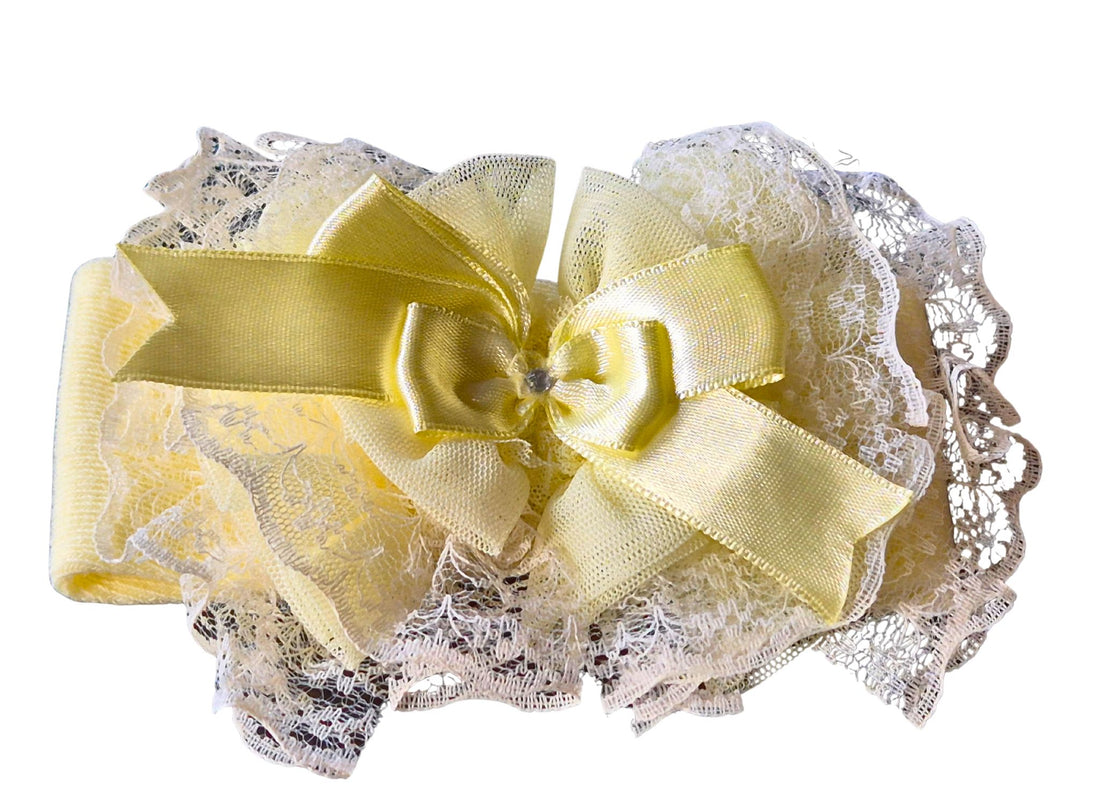 Yellow lace headband with a bow on a white background