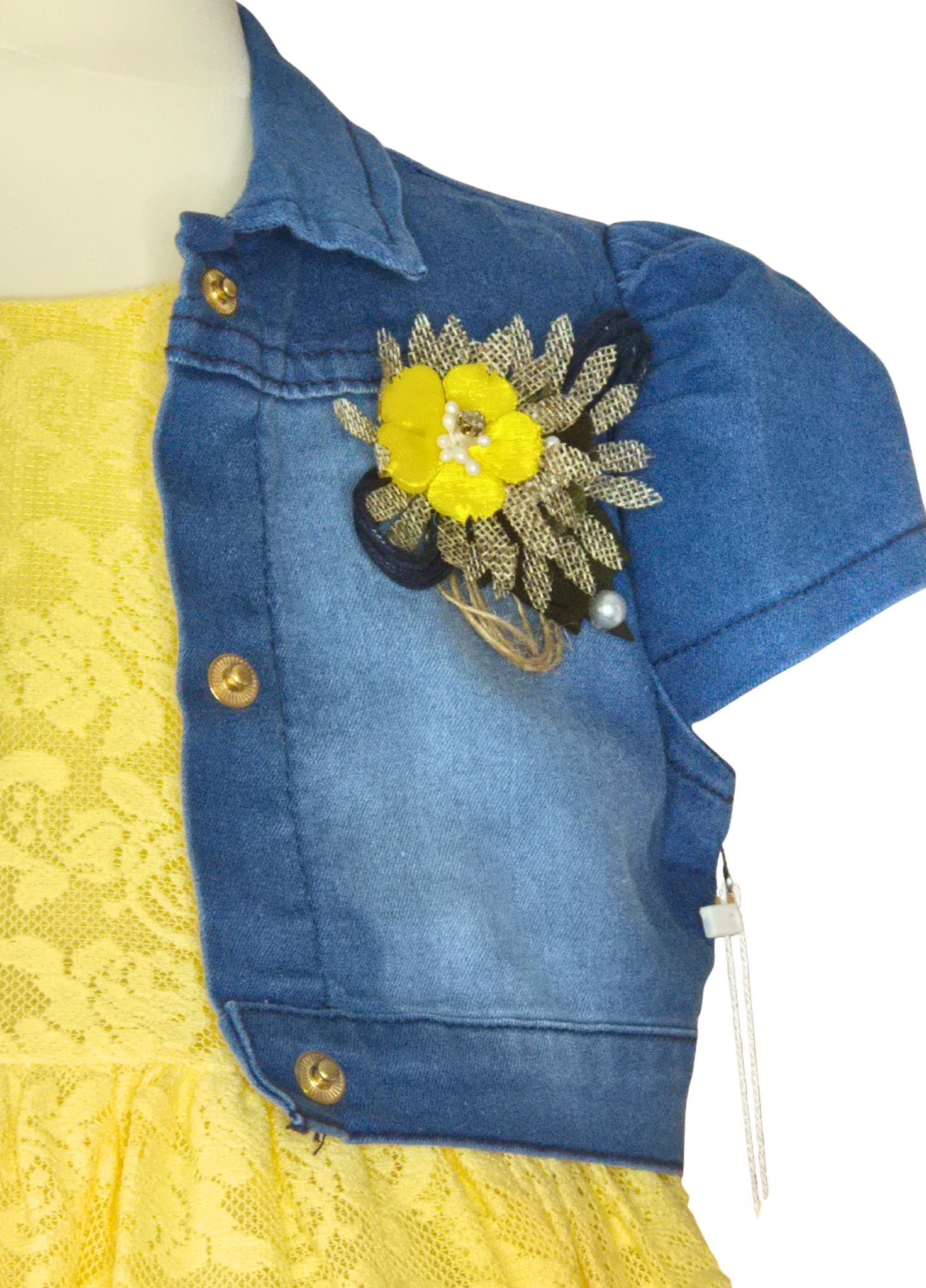 Blue denim shrug with a yellow flower design on a mannequin against a white background