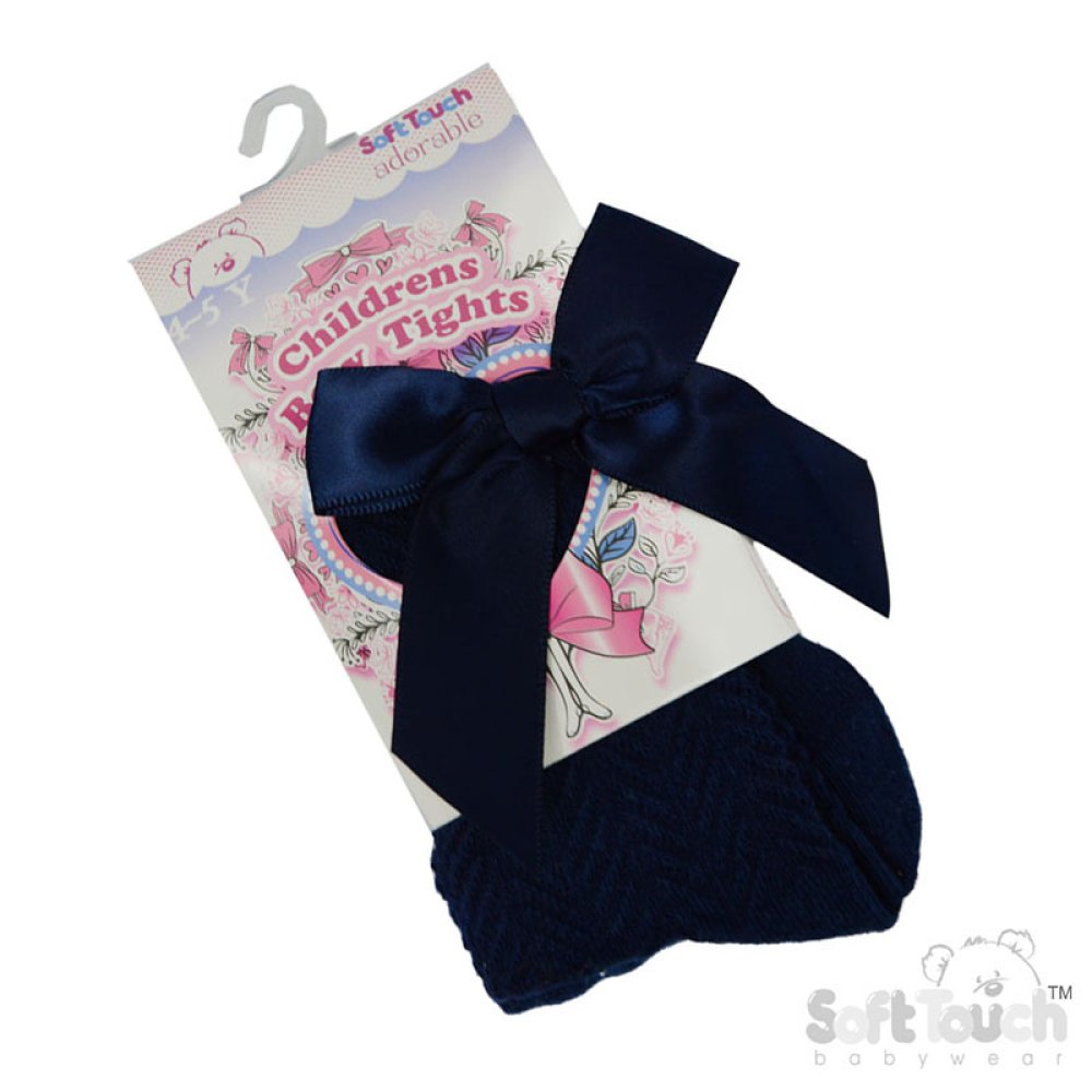 Navy blue children's tights with a large bow on a Soft Touch packaging background.
