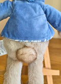Close up of Peter Rabits tail against a wooden background
