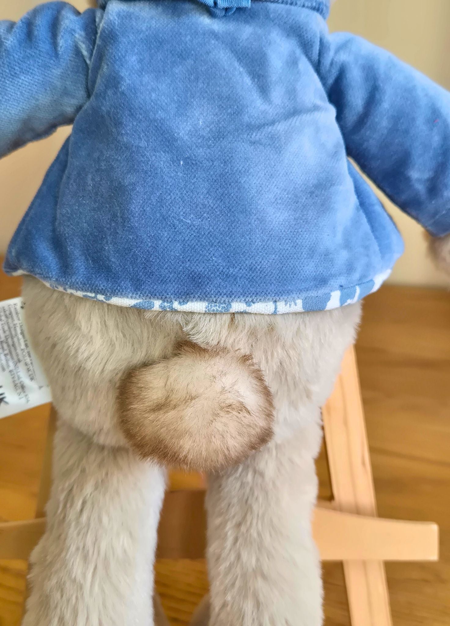 Close up of Peter Rabits tail against a wooden background

