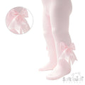 Pink tights with large bows and heart design on a white background, featuring the Soft Touch brand.