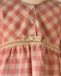 Pink checked swing top and cream frill hem trousers