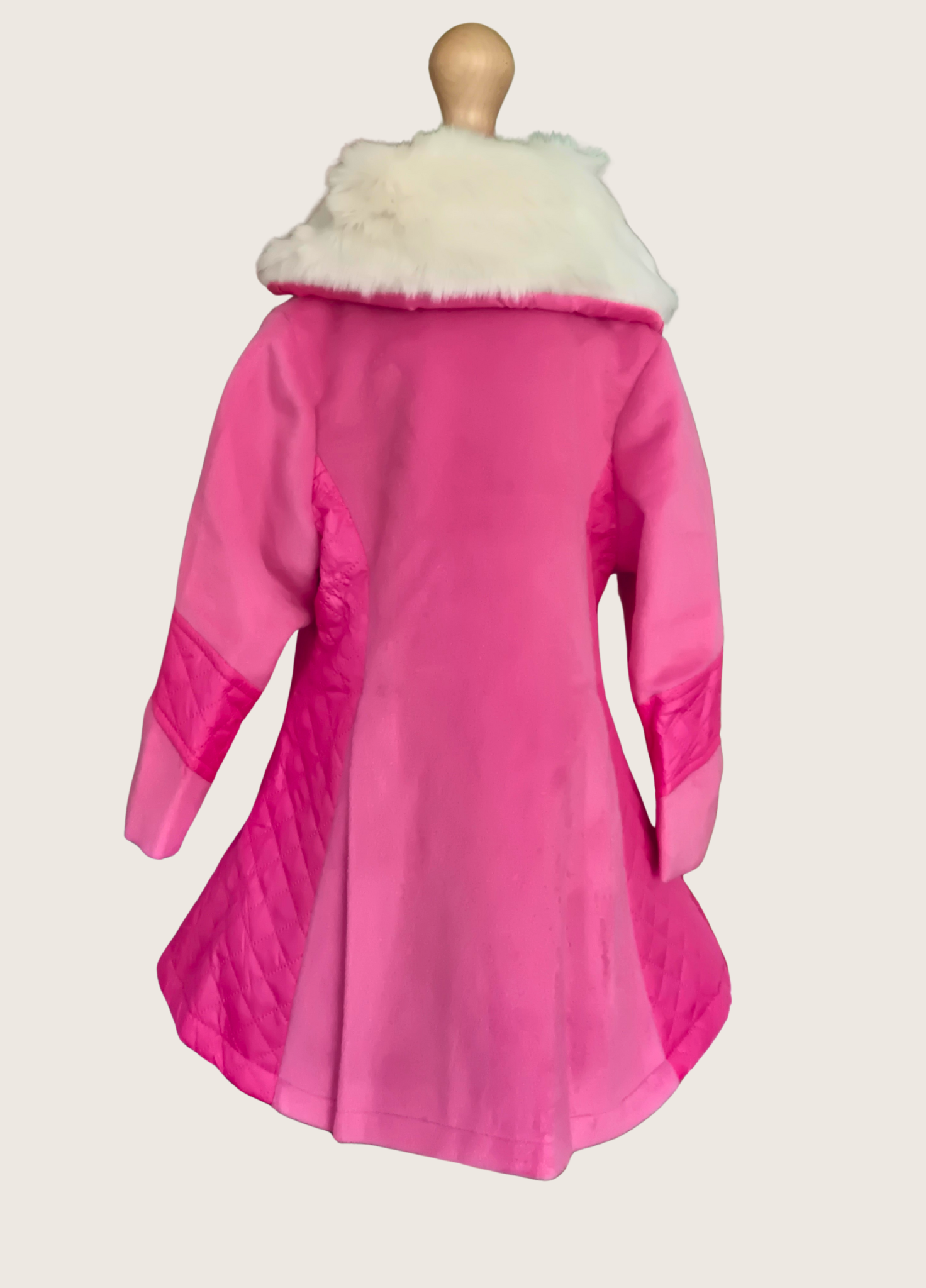 Back view of pink coat with white fur collar on a mannequin against a white background