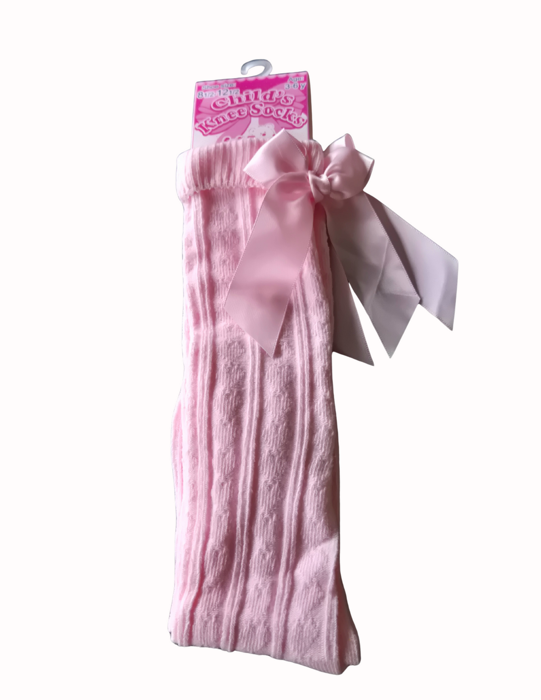 Pink knee-high socks with a bow detail on a white background