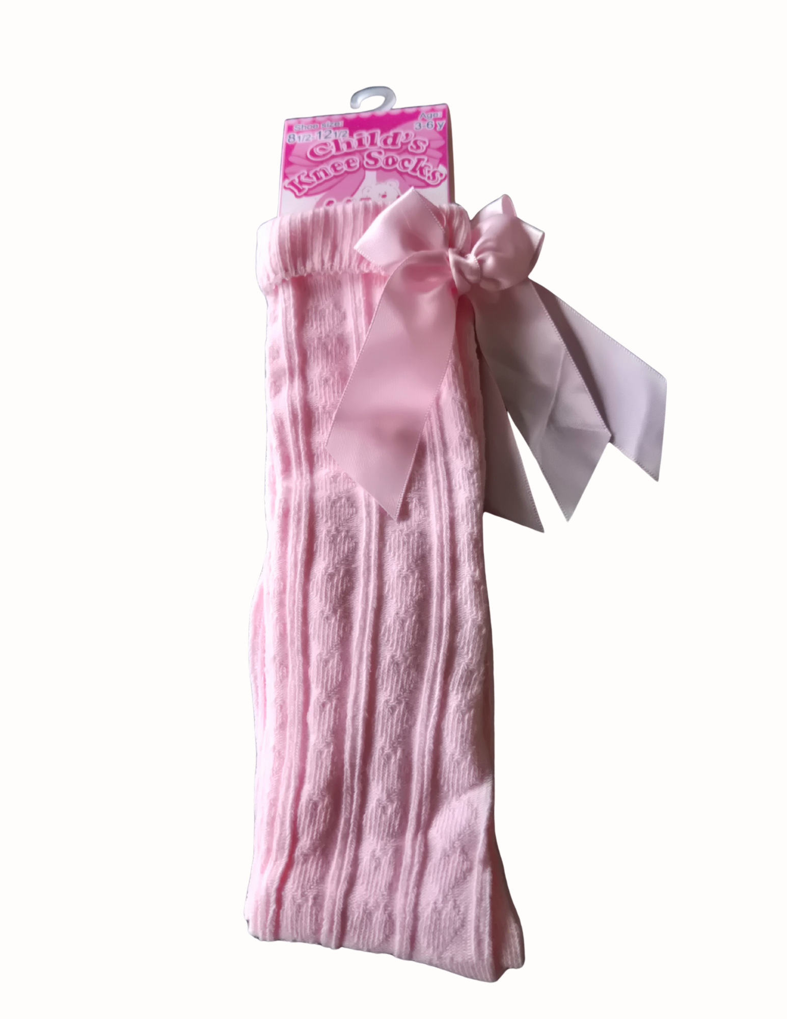 Pink knee high socks with heart pattern and bow on a white background
