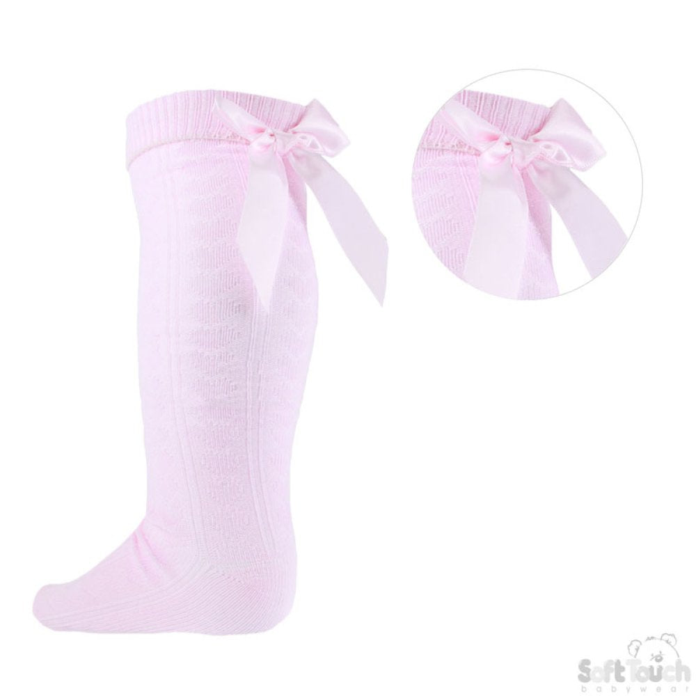 Pink knee-high socks with a bow detail on a white background