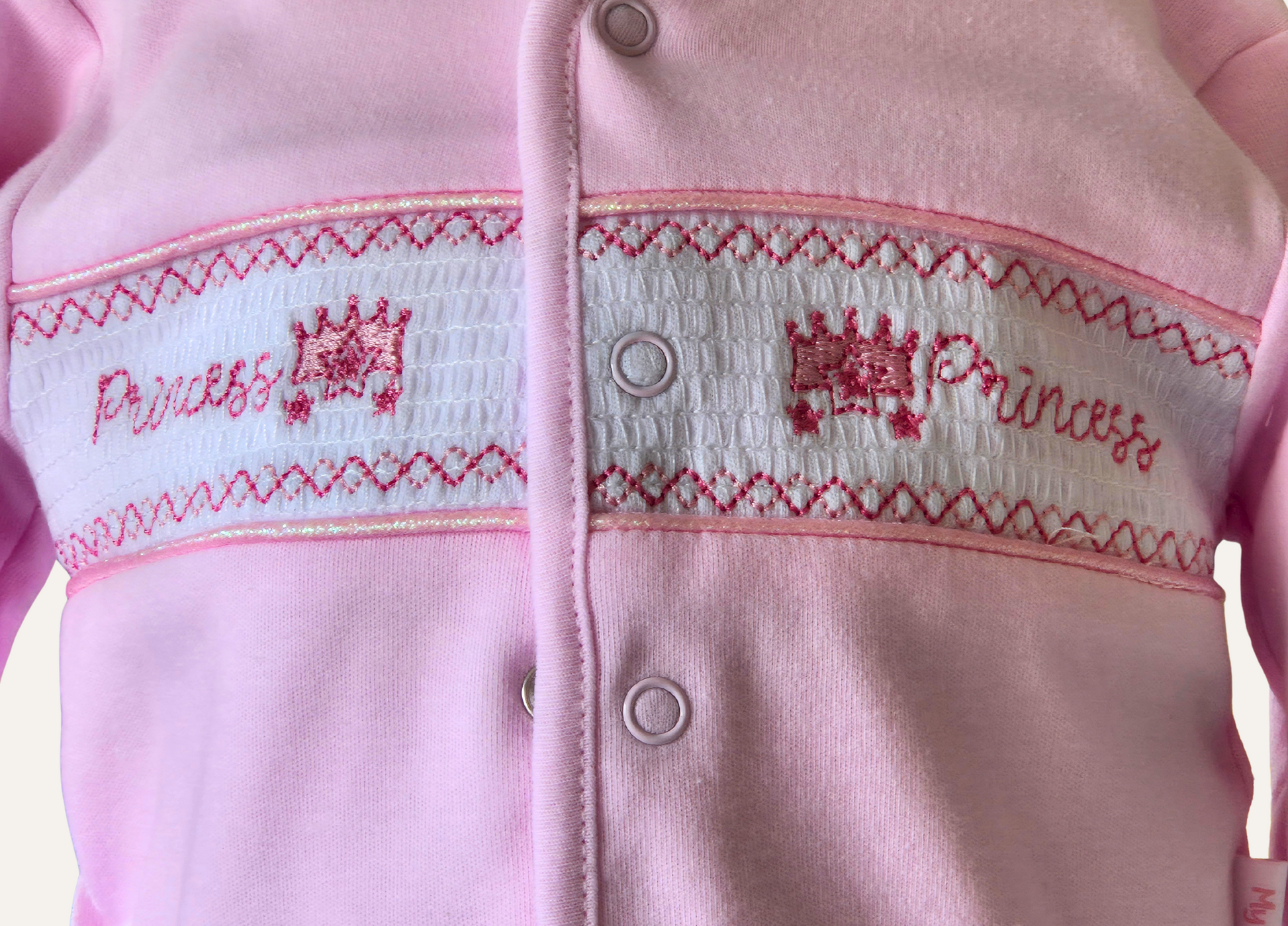 Smocking detail on the baby pink  princess jacket  part of the 2 piece set by My Little Chick
