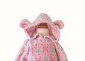 Close up of the hood and the ears on the pink rabbit and sheep hoodie on a white background
